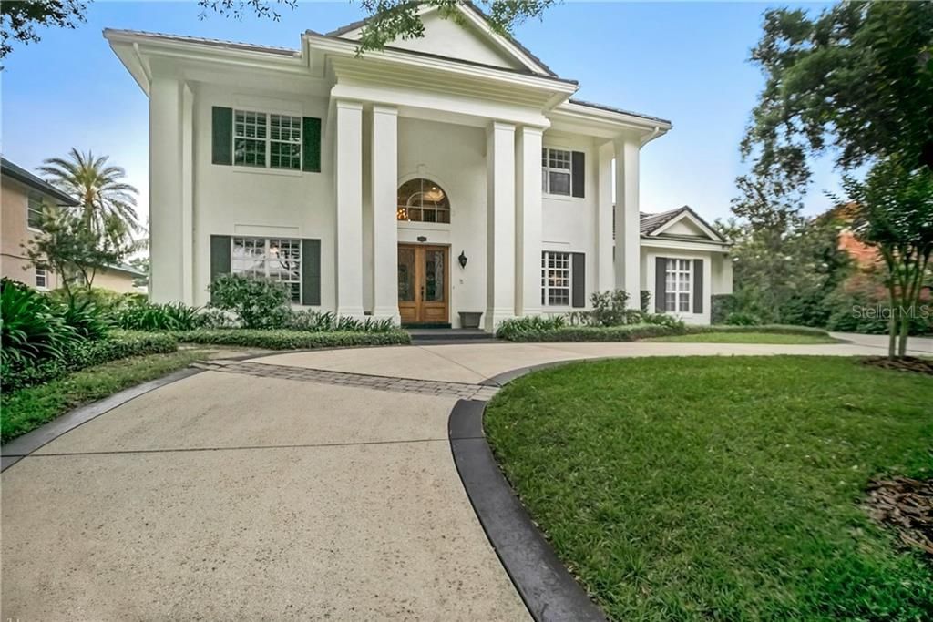 Amazing home with circular driveway and side garage.