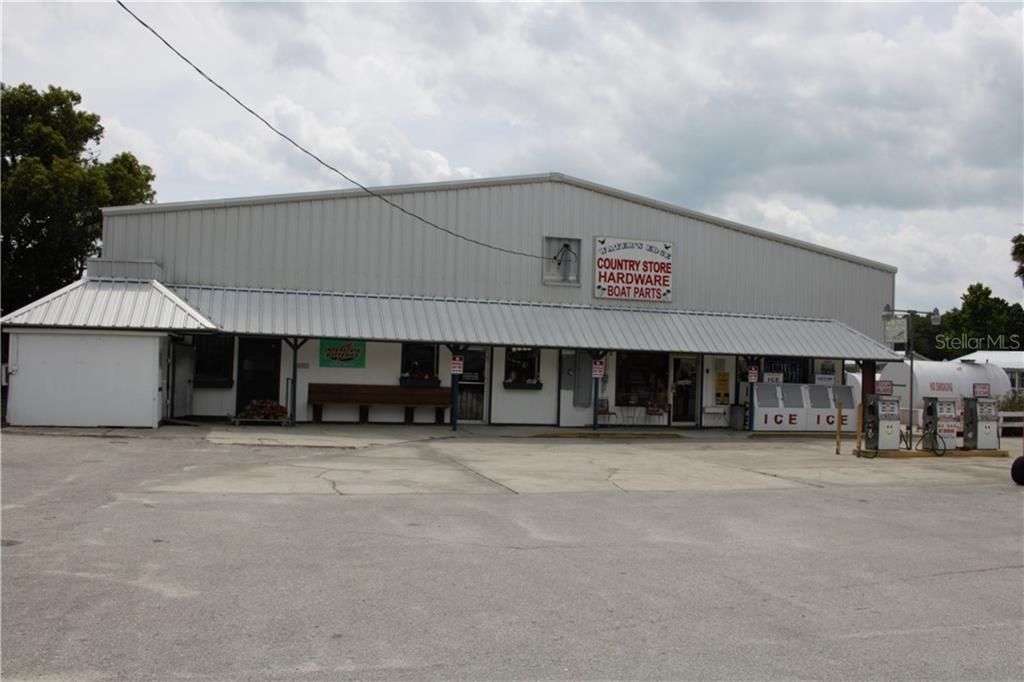 Water's Edge Convenience Store Front View - Gas Pumps, Ice Machines and Propane Tanks, etc.