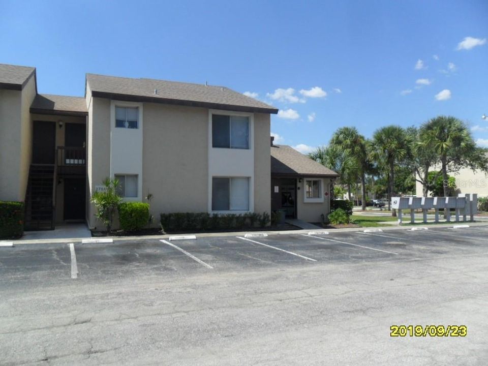Unit conveniently located next to laundry (small bldg at right) & clubhouse far right