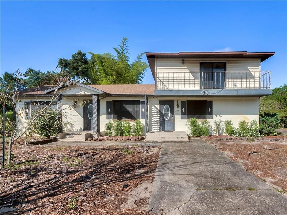 Front of home with 2 separate entrance doors