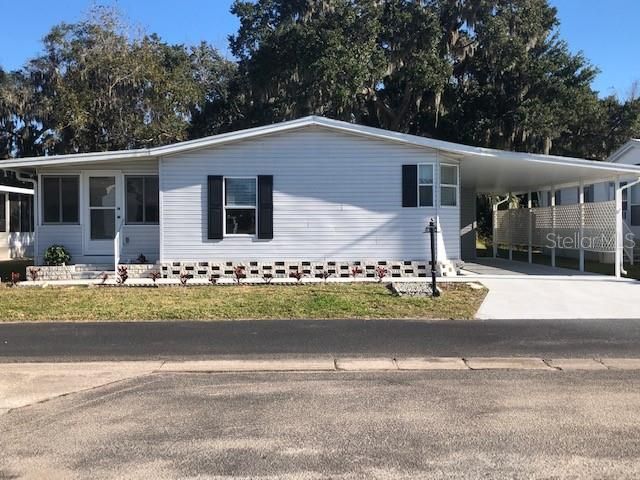 Handsome home, with great curb appeal, has newer shutters and freshly painted front walk and driveway.