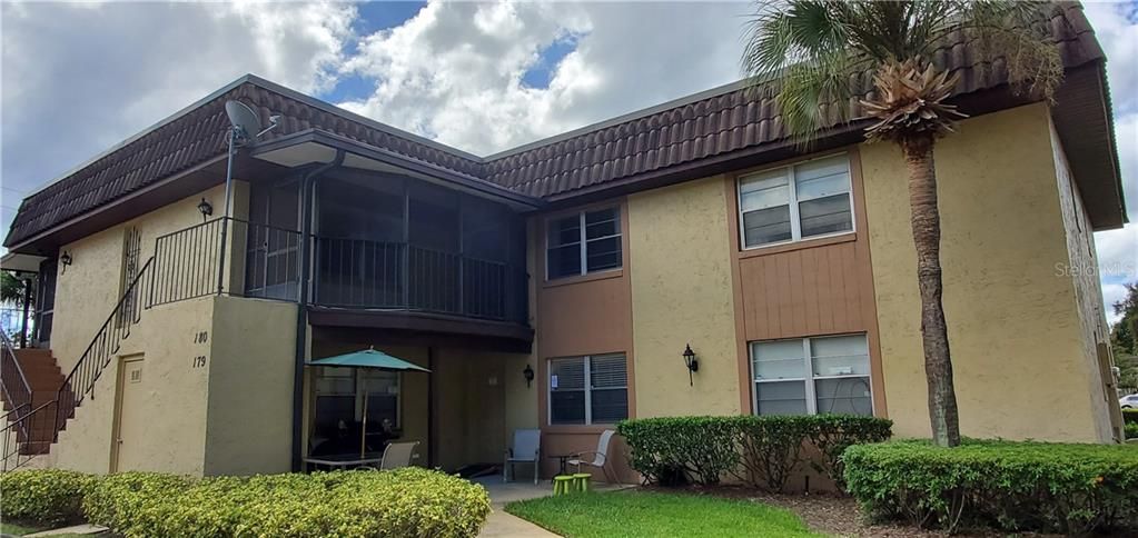 Great unit with a covered porch to enjoy the great Florida weather.