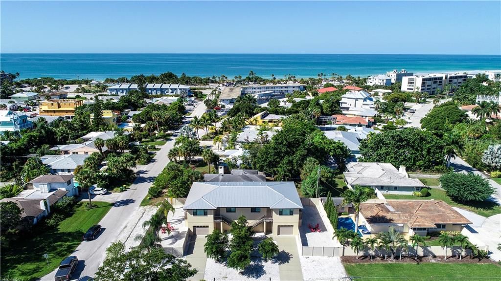 Exterior front Ariel view close to Lido Beach. Metal roof and fenced in side yards.