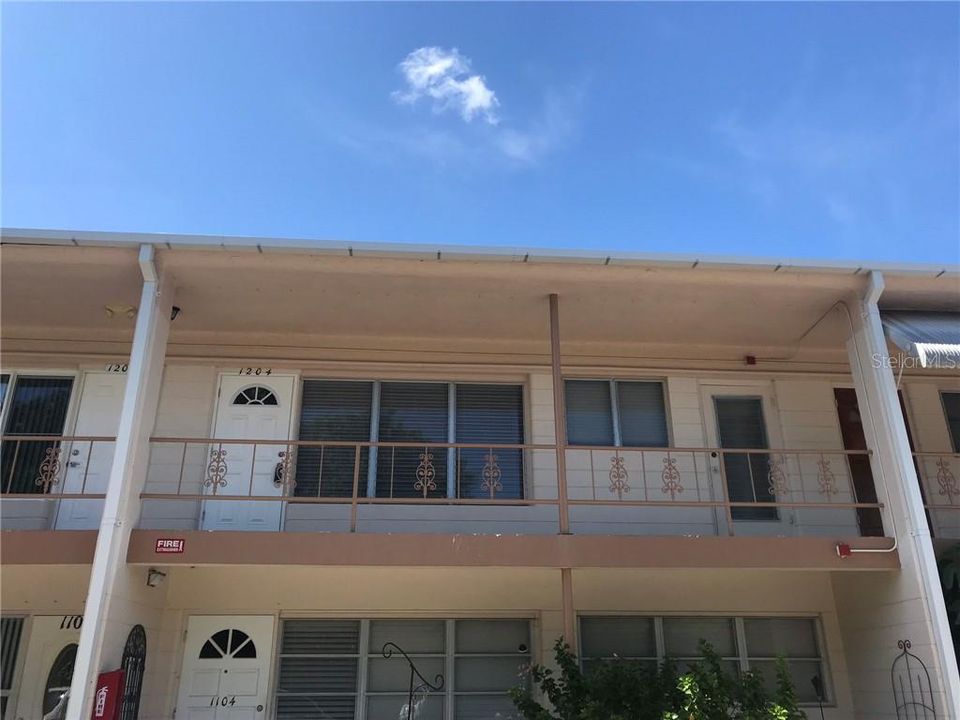 View of front of this 2 bedroom, 1 bath remodeled condo. Note that the 2nd bedroom has its own private door.