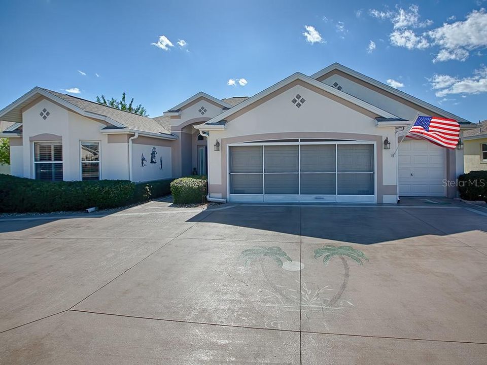FRONT EXTERIOR view - 3 BR/2 BA/2.5 CAR GARAGE Designer LANTANA home with SW rear exposure and a PEEK-A-BOO golf course view.