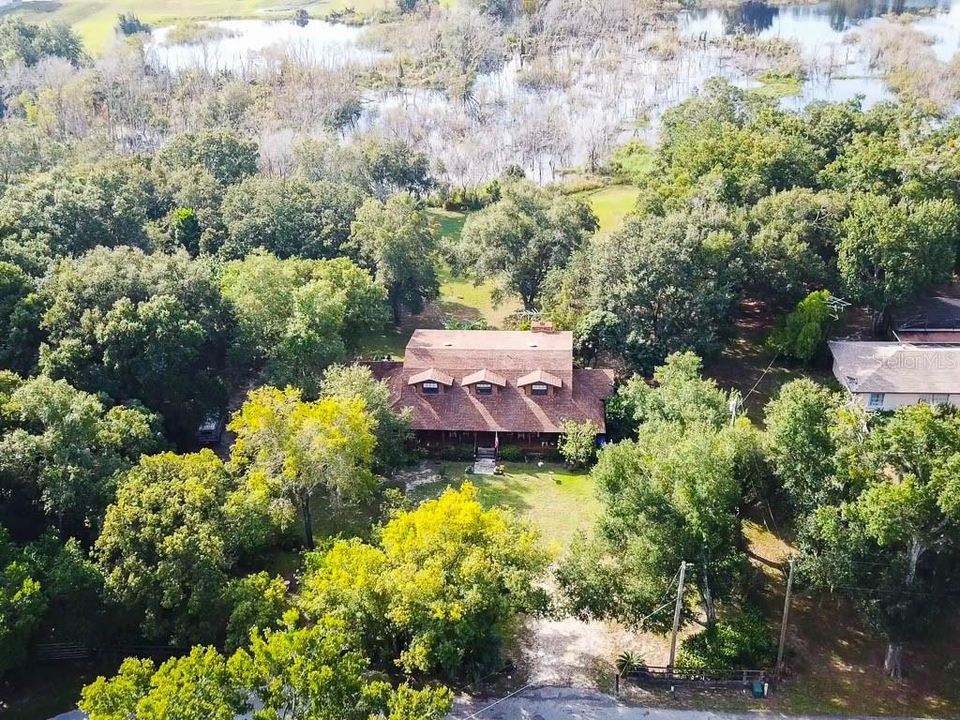 Aerial of Home and Lake Sparling to Rear