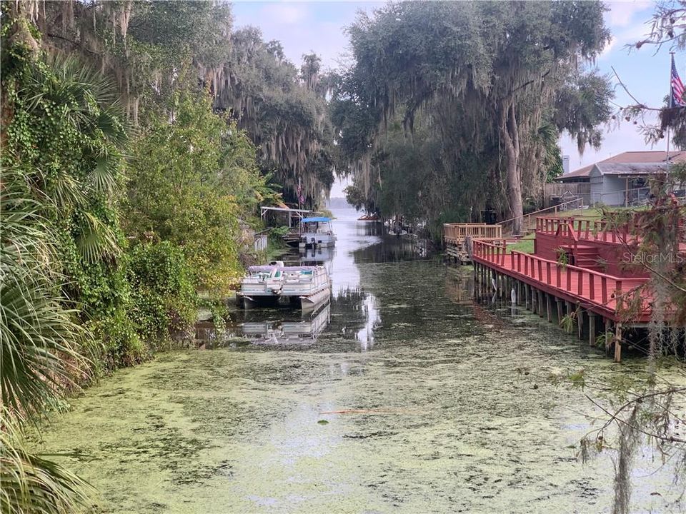 Straight on view of canal. Property is directly to the left where he canal meets land