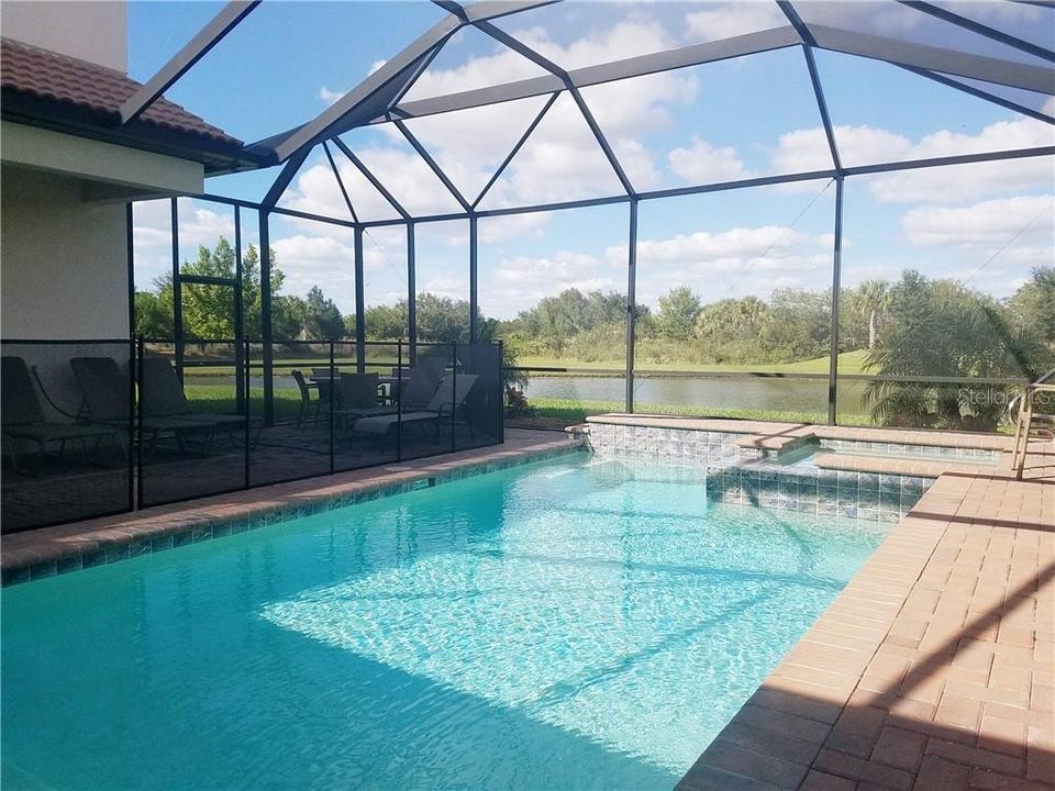 Pool with serene view of the pond