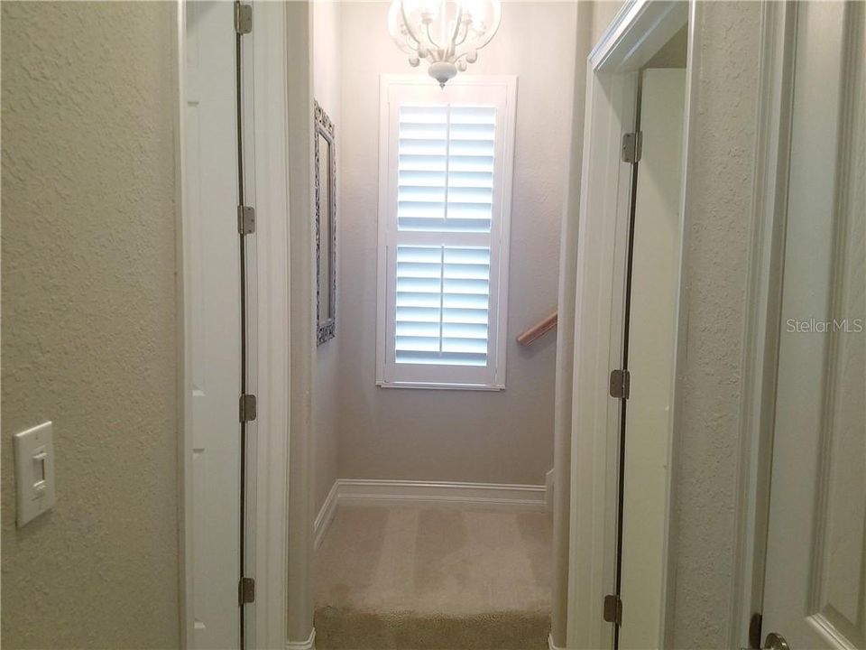 Hallway to the stairs full bonus room upstairs