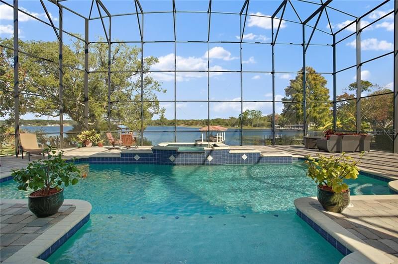 Welcome to this beautifully maintained lakefront residence on spring fed Lake Ola.