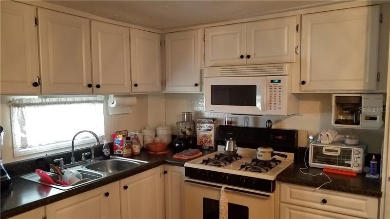 The kitchen is well designed and has ample cabinet space as well as a gas range, microwave and full sized refrigerator.