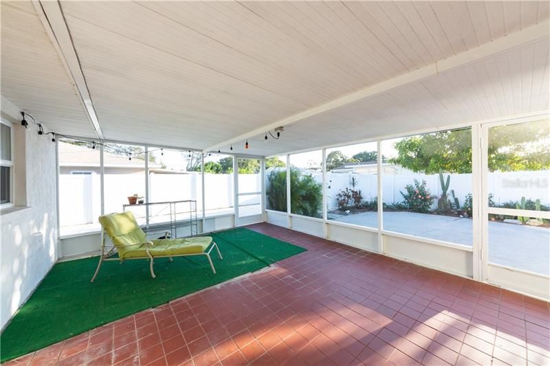 large covered lanai area, overlooking outdoor patio area