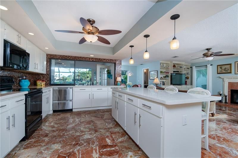 Kitchen overlooking family room and pool.