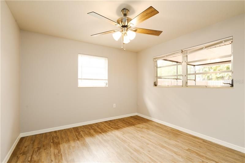 Second bedroom with lots of light and ceiling fan