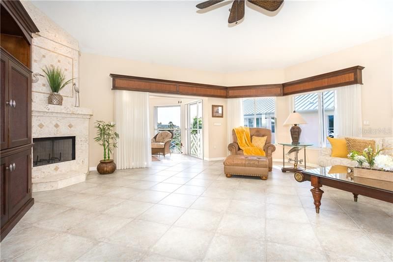 Tiled Living room extends to lanai overlooking marina & Intracoastal Waterway