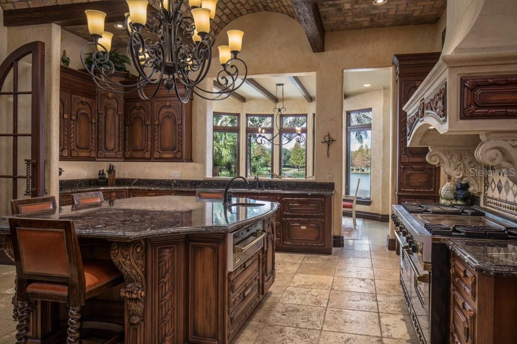 The kitchen offers causal bar seating for four and a breakfast nook with views of the serene Hourglass Lake.