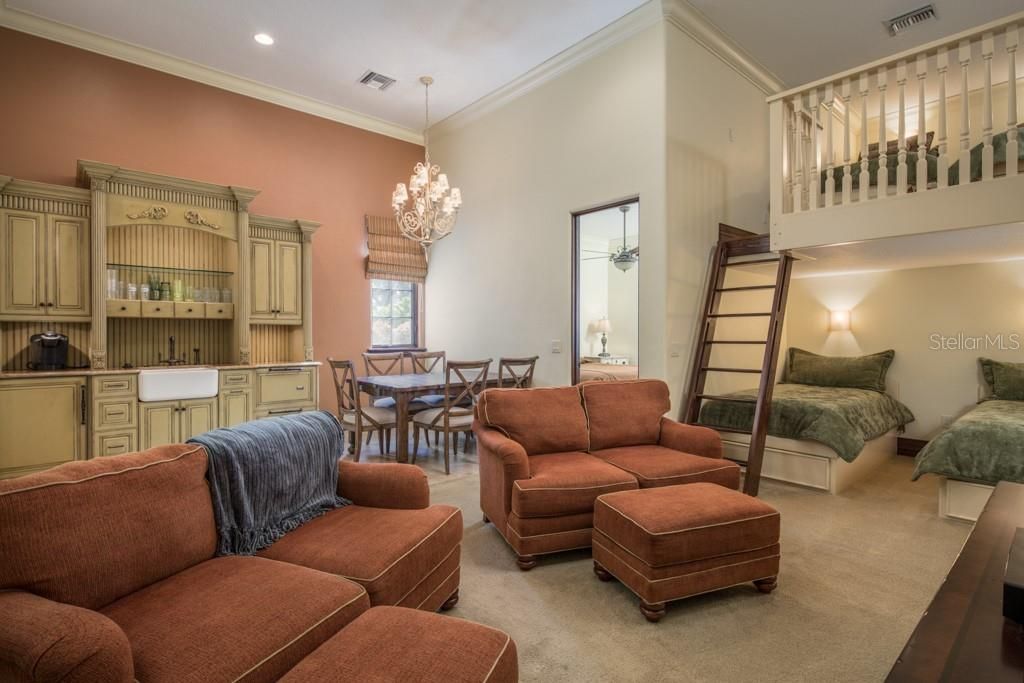 For additional sleeping, the family converted the secondary, three-car garage into a guest apartment, complete with kitchen, living room, full bath and loft.