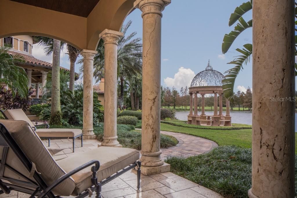 With breathtaking views of the grounds and waterfront, the east end guest house features a private covered lanai overlooking the garden gazebo.