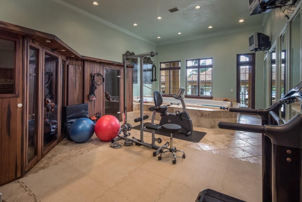 The in-home fitness center features heated sauna, a steam room and hydro-pool with detachable treadmill for water resistance exercise.