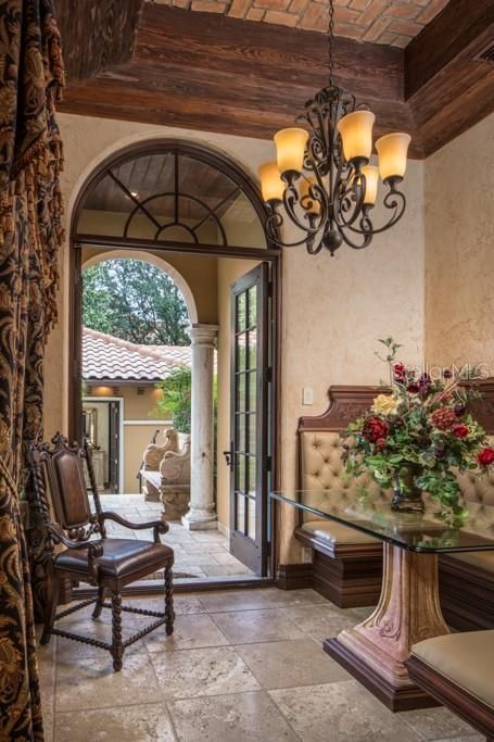 The original breakfast nook remains as a cozy feature to the estate with custom built, corner booth and access to the east end covered lanai.