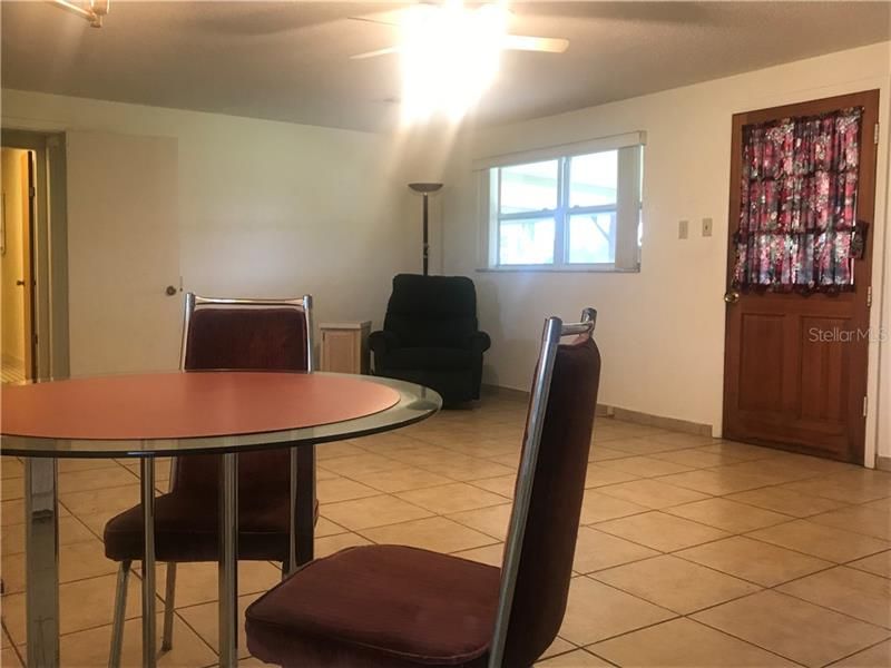 A view of the open floor plan of the living room and dining room.