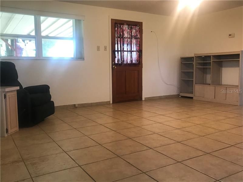 Front door opens to the living room.  Ceramic tile flooring thru the entire home and new double pane windows have been installed too.  The refrigerator and dishwasher are only a couple of years old.