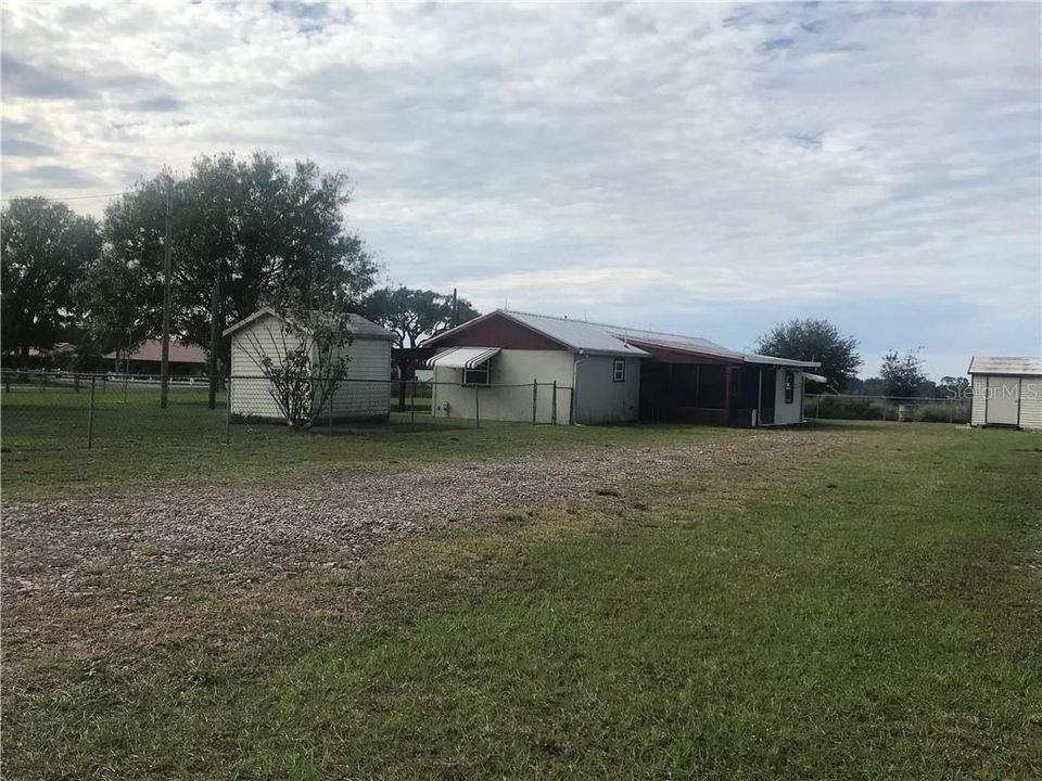 Drive way is located off Alturas Loop Rd.  The front yard is fenced in and there are 2 sheds on the property.  Both sheds have electric to them.