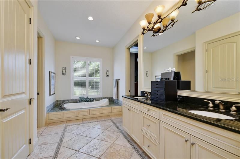 Master Bath with Jacuzzi jetted tub with huge walk in closet and additional 2 closets.