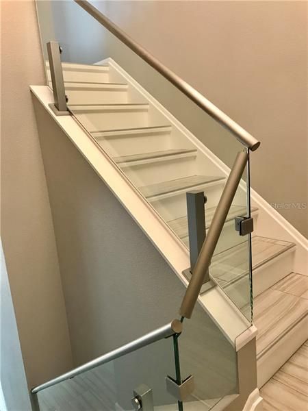 Staircase with glass railings