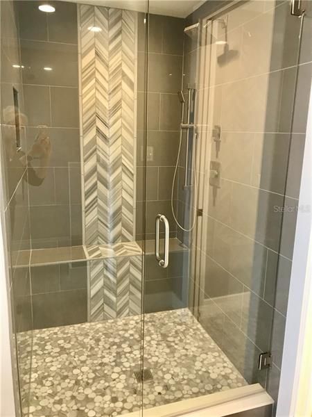 Huge master shower with seat