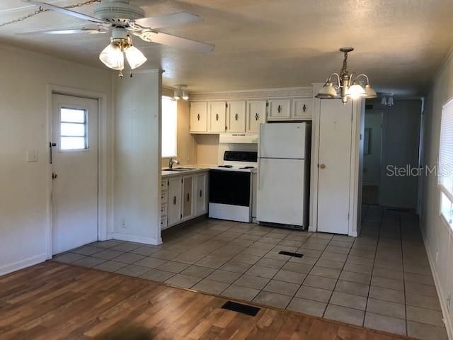 Kitchen has closet pantry and opens to dining area and family room.