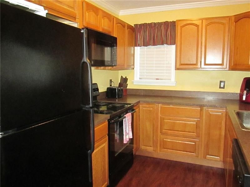 Matching black kitchen appliances stay for the new owner!