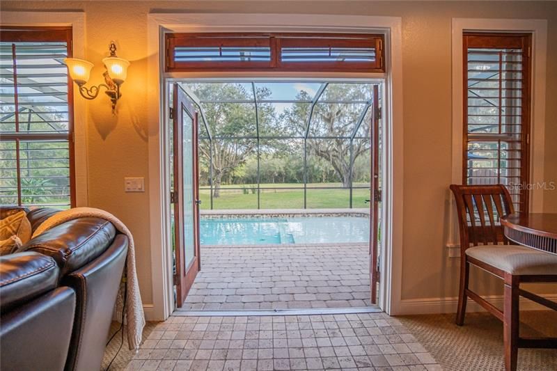 French doors open directly from Family Room to Pool area.