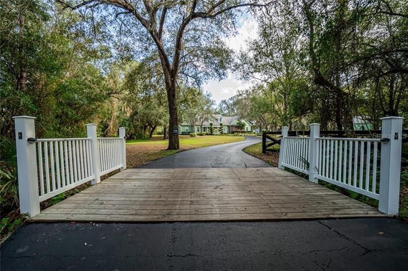 Front driveway has you drive over a small creek. House is NOT located in a flood zone.