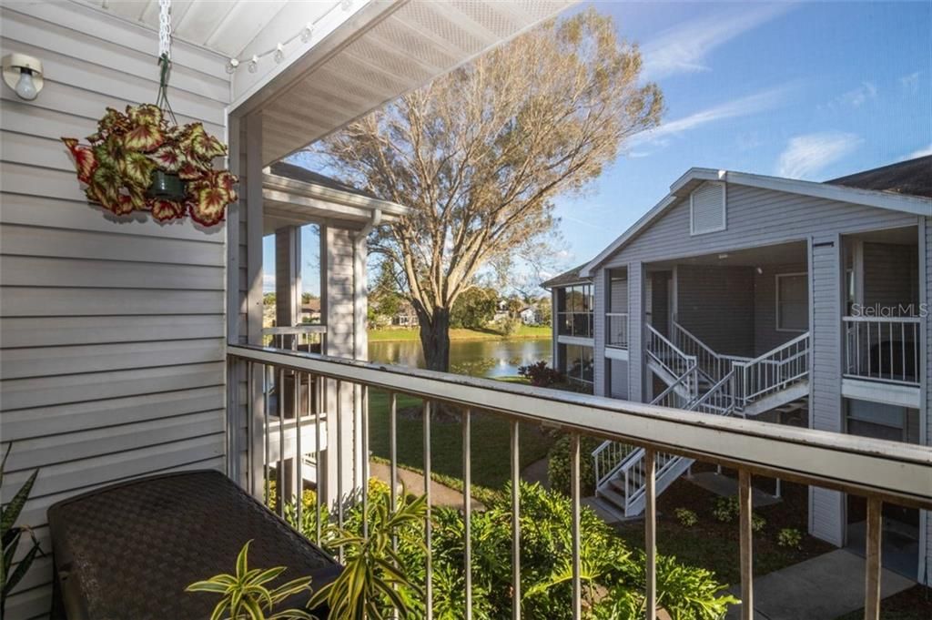 Relax, enjoy and entertain on your screen-enclosed cover lanai with its serene partial lake view.