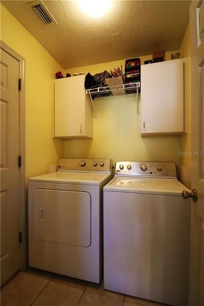 INSIDE LAUNDRY ROOM WITH EXTRA STORAGE