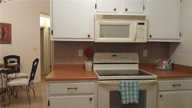 Kitchen includes Range/Oven, Microwave, and wide cabinets for generous storage.