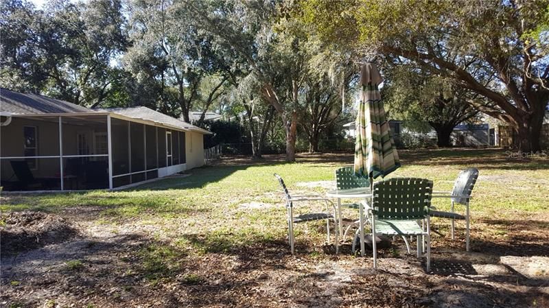 Backyard view to the West shows off the 444 square feet of additional Florida lifestyle living on the screened patio.