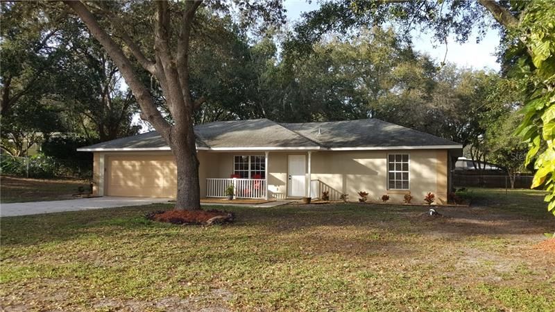 Lovely home on site that is over half-acre. Relax on your covered front porch. Enjoy the peace of lots of room between neighbors.