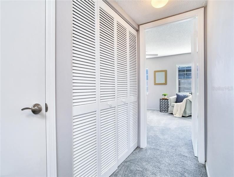 Upstairs Hallway with Large Linen Closet and Convenient Laundry Closet with W&D hookups