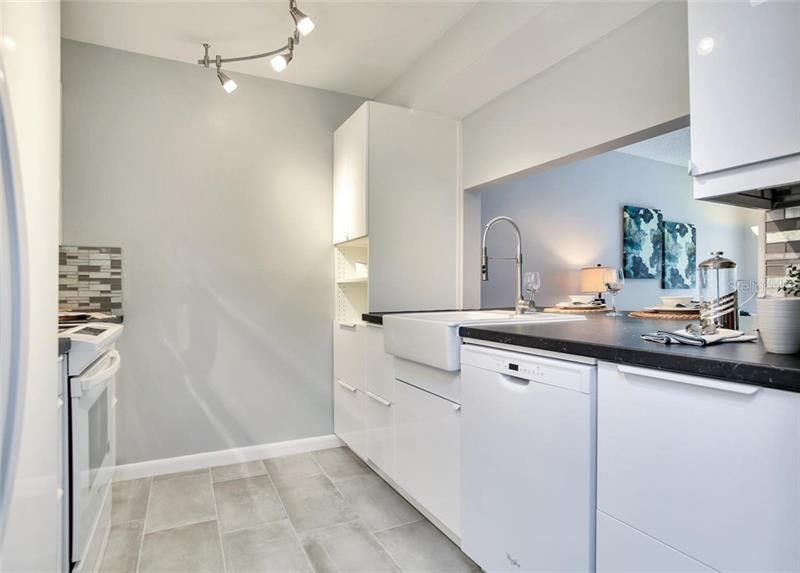 All New white Kitchen with white laquer cabinets, white appliances, white farm sink