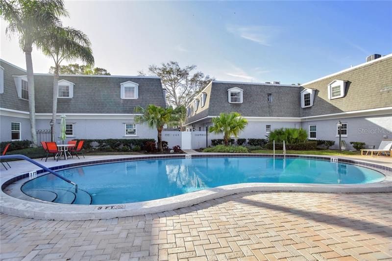 Pavered Pool Deck with plenty and patio furniture to enjoy...Florida Living at it's Best.