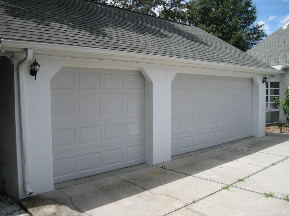 Garages with Work Room, 2.5 Car carport to left of garages.