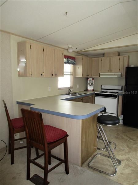 Kitchen includes refrigerator & Gas Stove