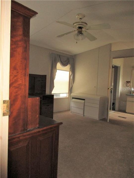 Master bedroom , see large bath with 2nd walk in closet, sink, commode, and stand in shower.