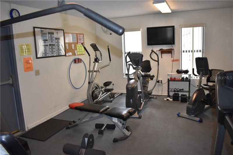 Fitness center w/equipment and TV.