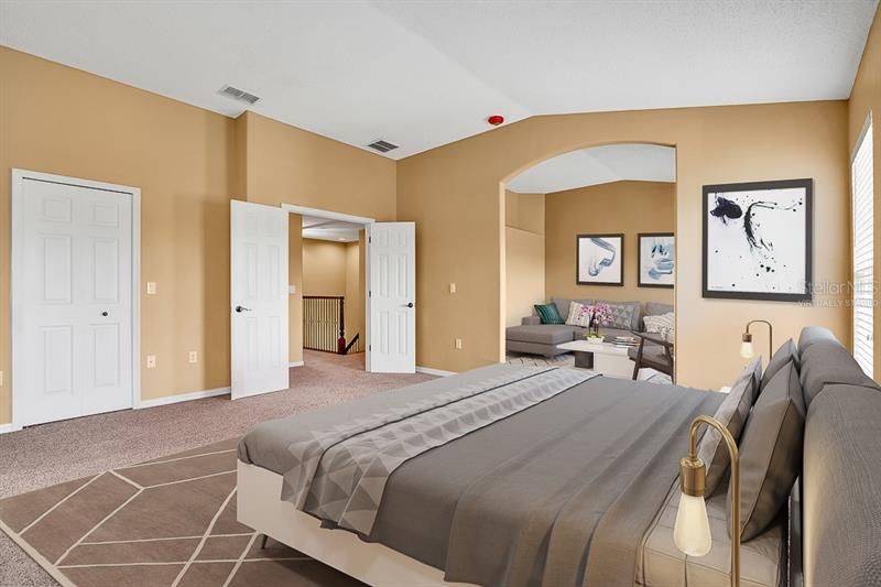 Virtually staged master bedroom with adjacent sitting area, office or nursery.