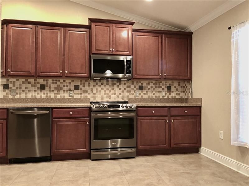 Kitchen with NEW stainless steel appliances