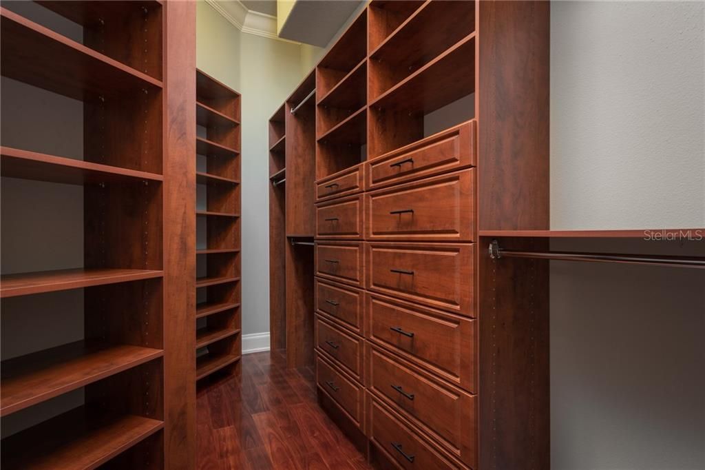 Master closet with built-ins (wide angle lens distorts)