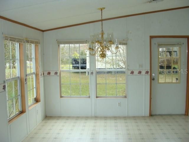 Dining room with lots of natural light and a door to the side yard